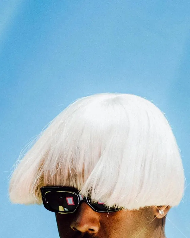 Portrait of Person with Blonde Hair and Sunglasses