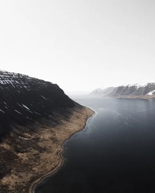 Mist-covered mountain lake landscape