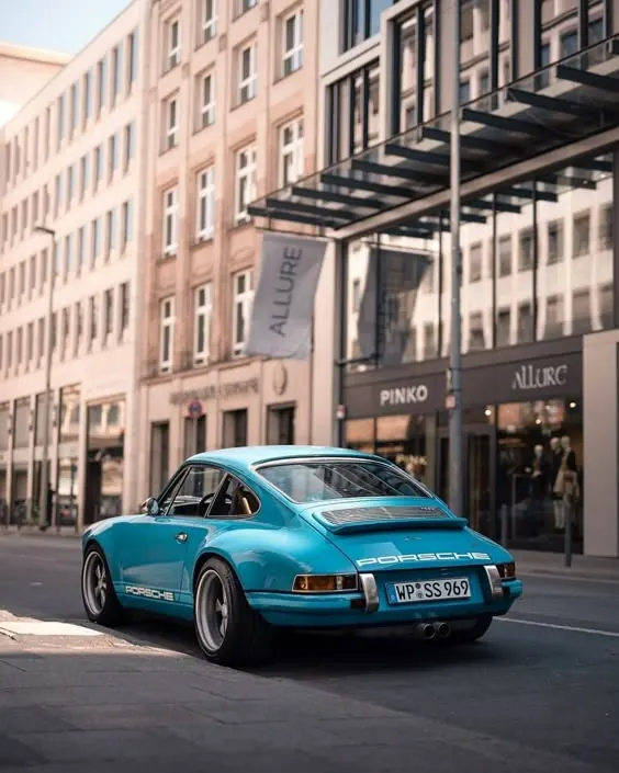 Teal Vintage Car in Urban Setting
