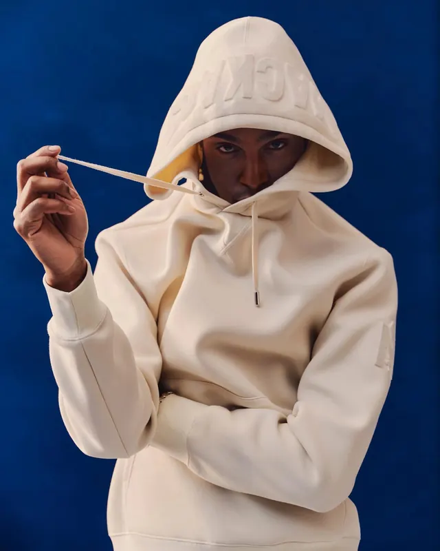Hooded Figure with Straw