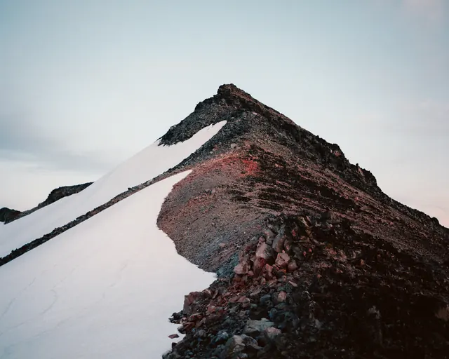 Cascadia mountain with snow slopes, photographic, bold, dark