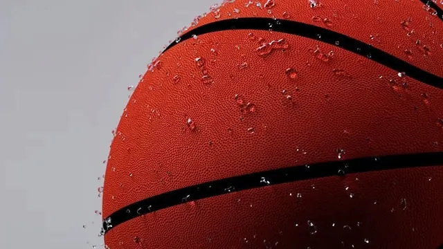 Water droplets on orange basketball macro, photographic, minimal, vibrant