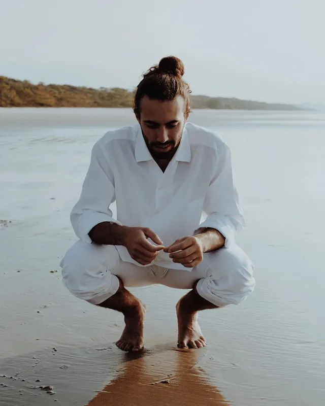 Man in White Linen on Beach