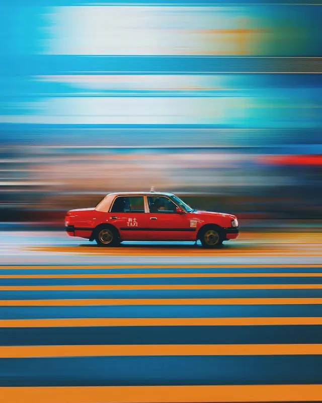 Motion Blur Red Sedan