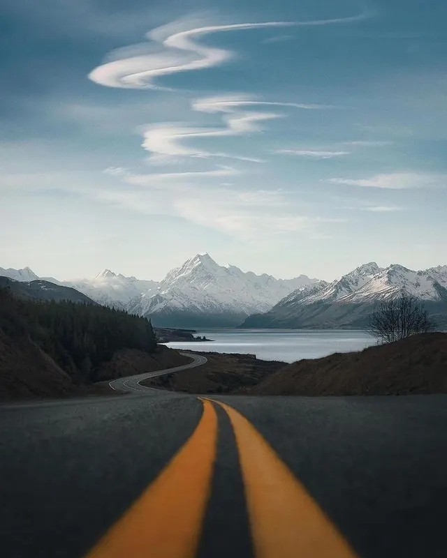 Mountain landscape with winding road perspective, photographic, minimal, cool