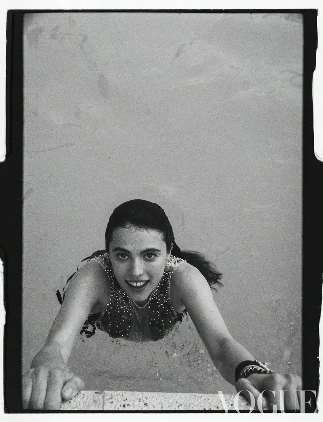 Black and white Vogue portrait of woman in pool, photographic, editorial, monochrome
