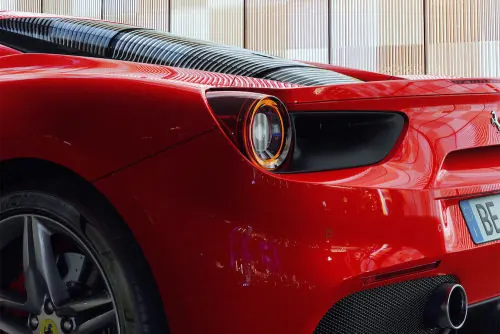 Ferrari rear taillight detail, minimal, luxury, vibrant