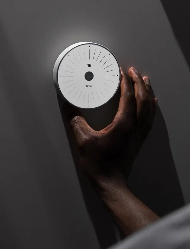 Minimalist circular wall timer with hand interaction, minimal, technical, light