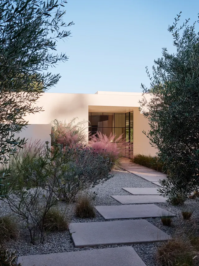 Minimalist white modern home with gravel path, minimal, photographic, muted