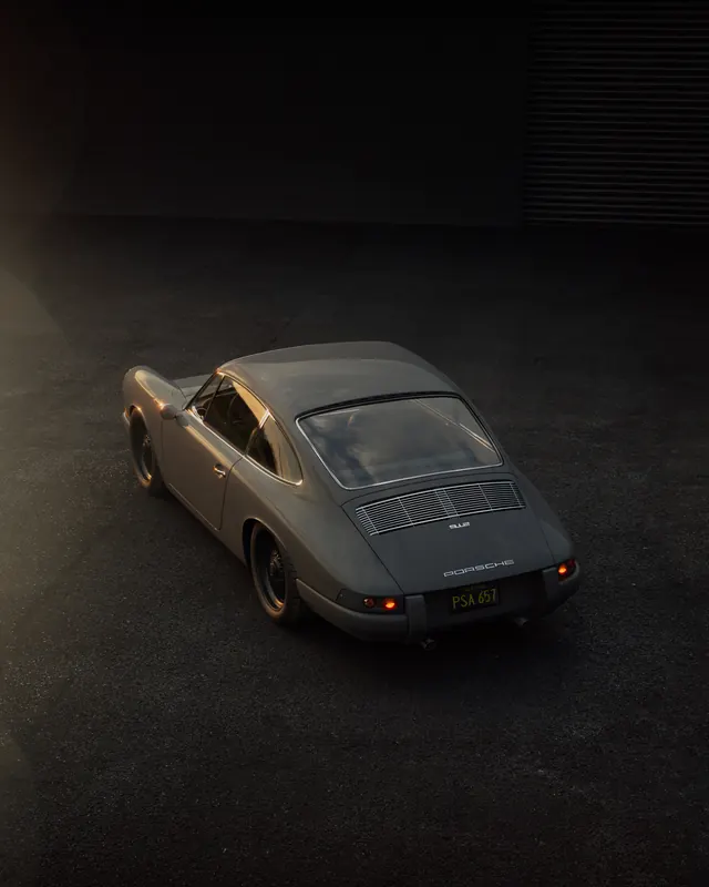 Matte Porsche 912 classic car in dark studio, photographic, luxury, dark