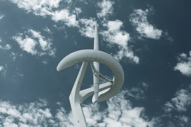 White architectural sculpture tower against sky, photographic, minimal, light