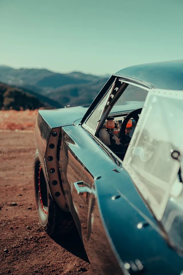 Vintage Blue Car in Desert