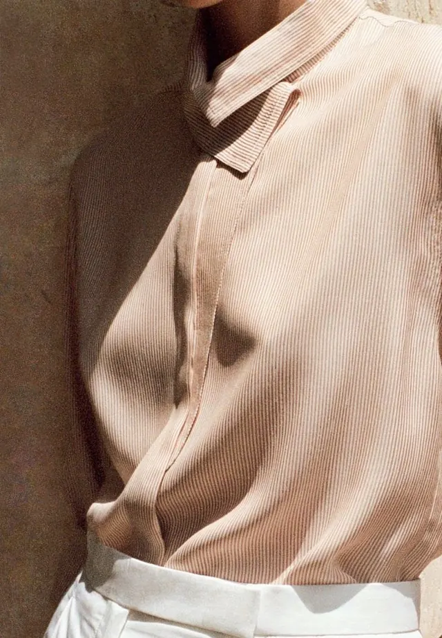 Oversized ribbed sweater detail, photographic, minimal, warm