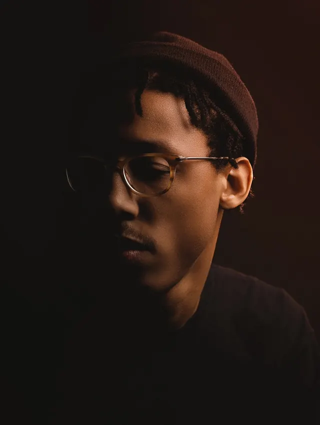 Portrait of Man with Glasses and Beanie, photographic, editorial, dark