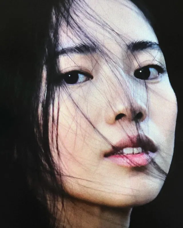 Close-up Portrait with Hair Across Face, photographic, editorial, dark