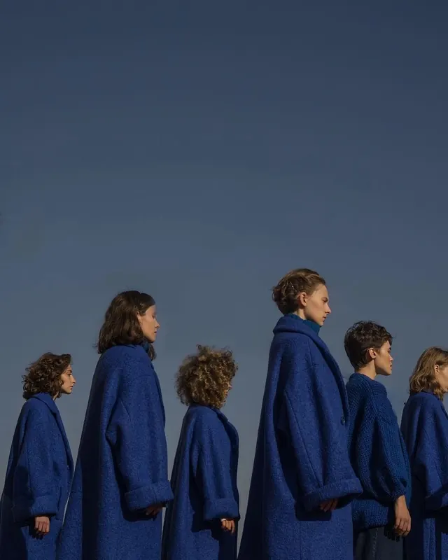 Minimalist group portrait with coordinated clothing, minimal, photographic, cool