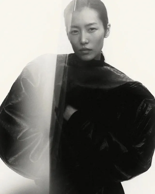 Fashion editorial black and white portrait, photographic, minimalist, dark