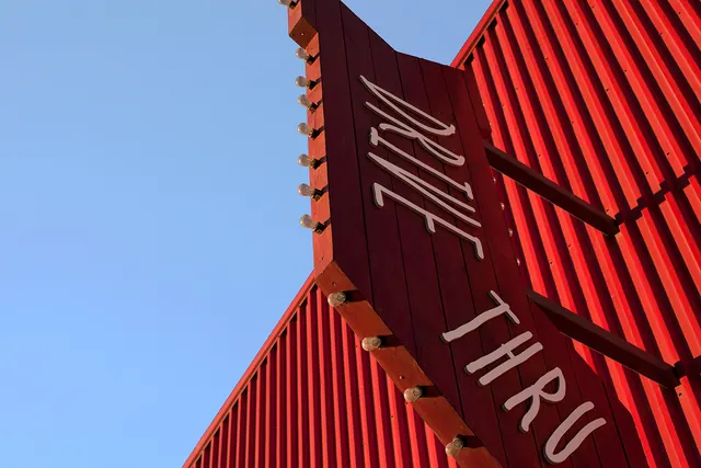 Red Architectural Structure with White Text