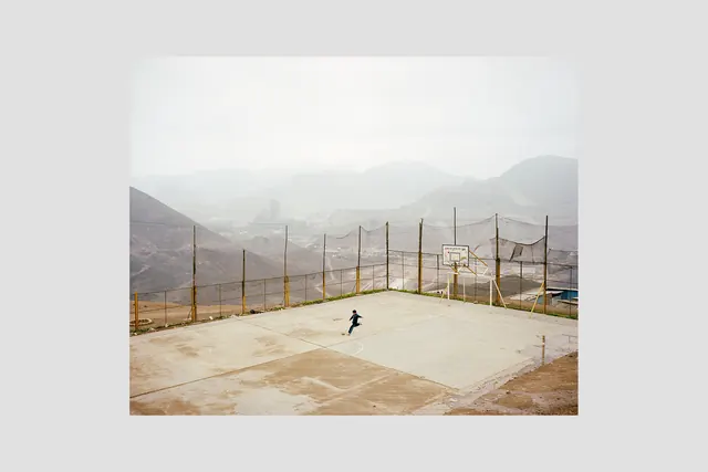Mist-covered mountain sports court