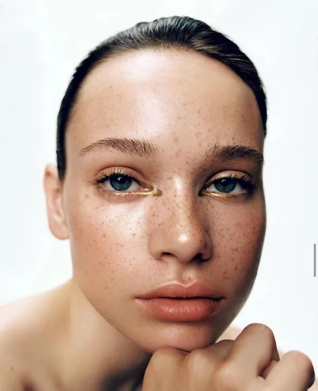 Close-up beauty portrait with freckles, photographic, light