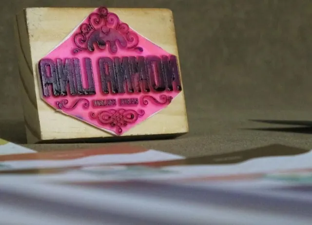 Bright pink vintage sign stamp, retro, playful, vibrant