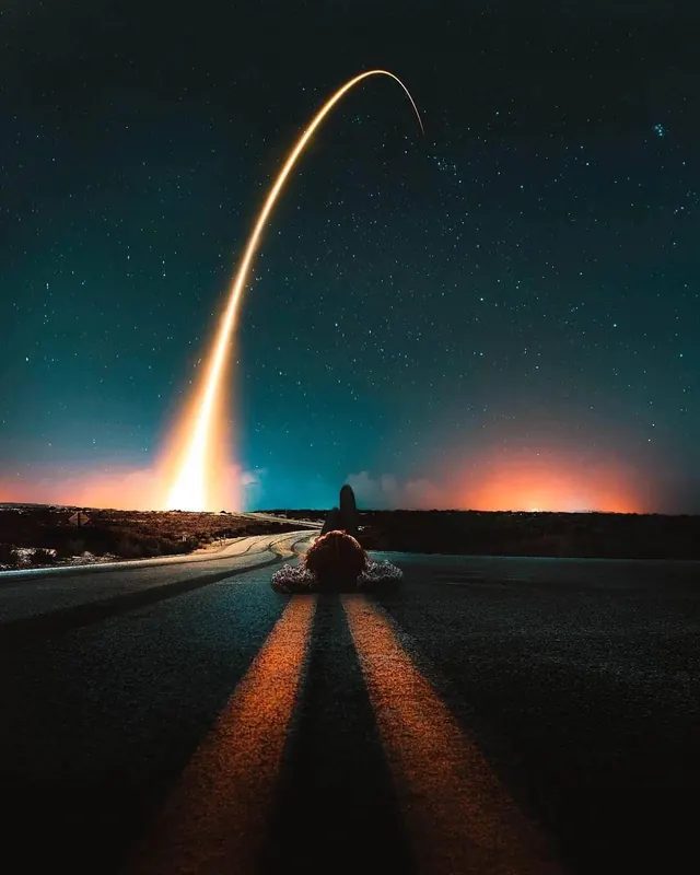 Rocket launch viewed from road at night, photographic, dramatic, dark