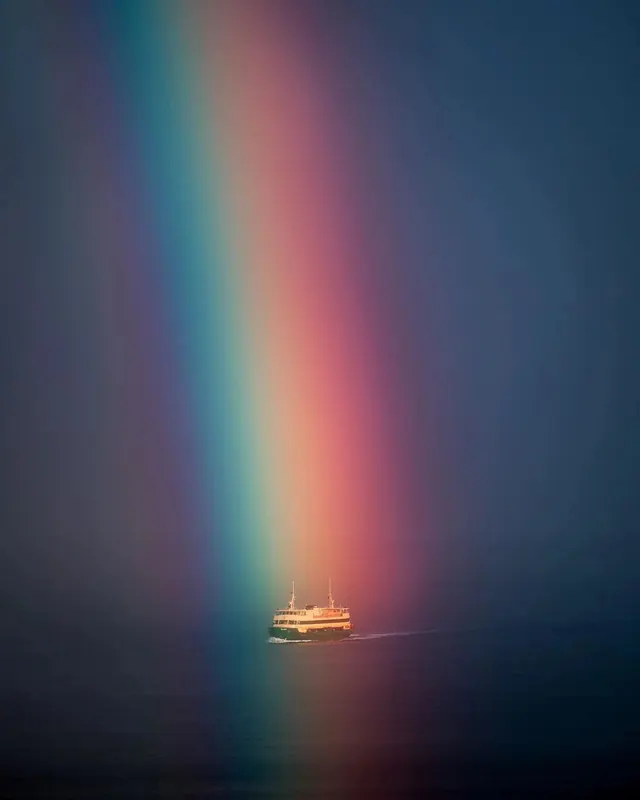 Rainbow Light Beam over Boat