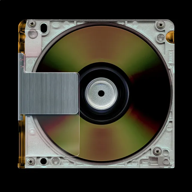 Iridescent CD in translucent case, minimal, photographic, dark