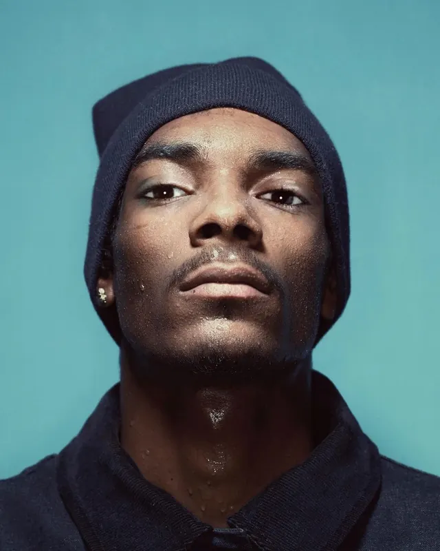 Close-up male portrait with beanie, photographic, minimal, cool