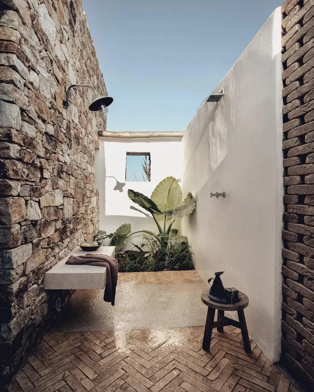 Stone and stucco outdoor shower, minimal, organic, light
