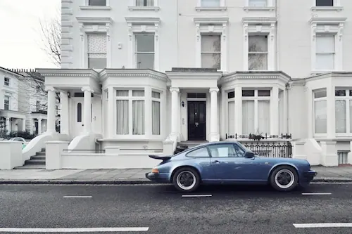 Classic Blue Sedan in Urban Setting