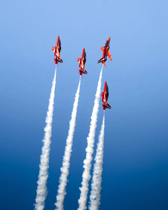 Red arrows aircraft formation, photographic, vibrant