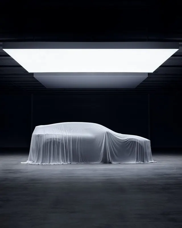 Car covered in white sheet under studio light, minimal, photographic, light