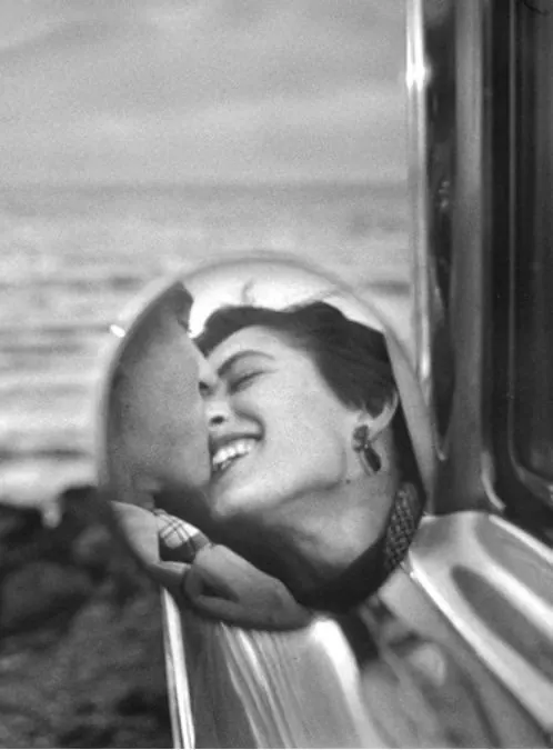 Vintage black and white portrait of woman by window, photographic, retro, monochrome
