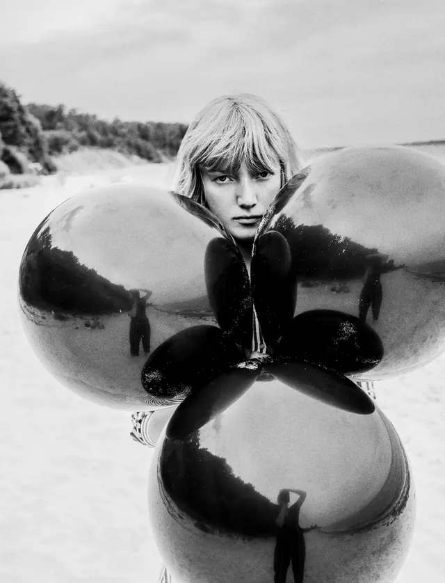 Surrealist composition with oversized spheres, photographic, surrealist, monochrome