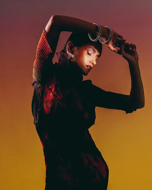Pleated fashion editorial portrait, editorial, photographic, dark