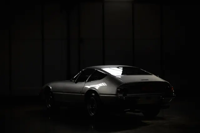 Ferrari Daytona low-key rear studio shot, luxury, photographic, dark