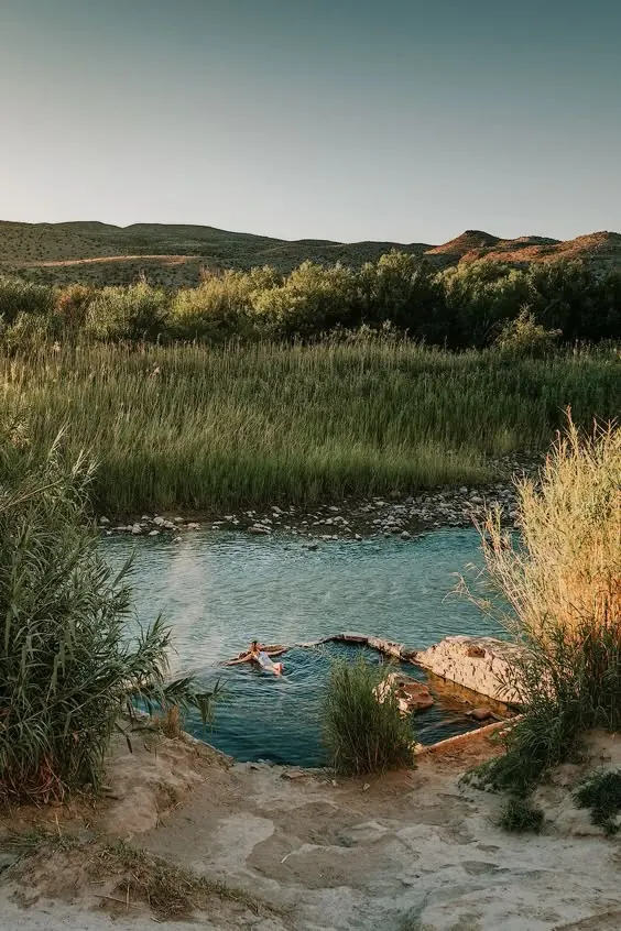 River-edge stone pool bather, photographic, organic, warm