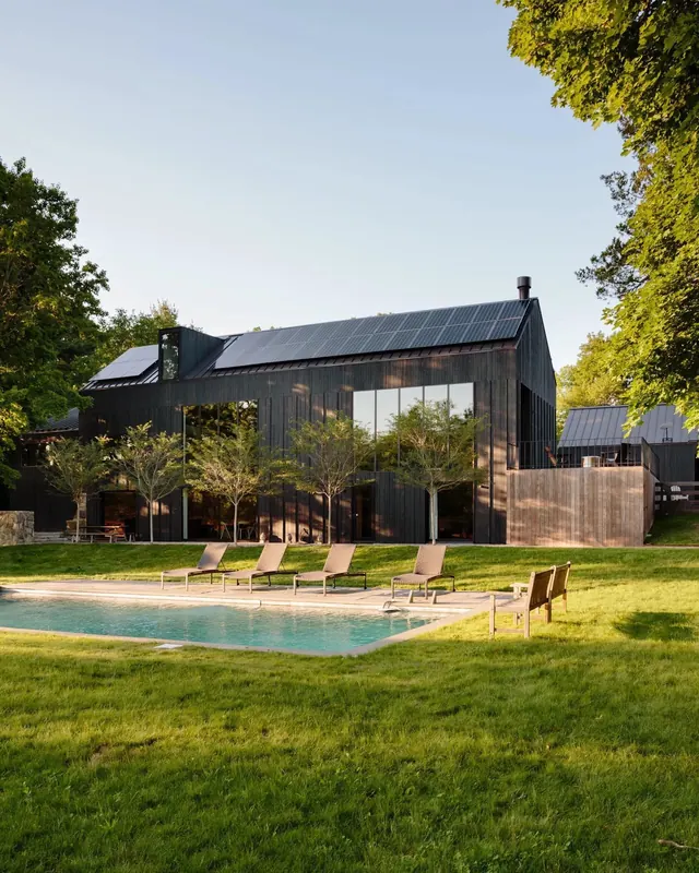 Black barn house with pool, minimal, photographic, dark