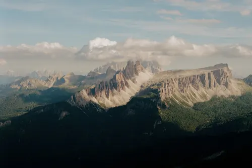 Alpine mountain landscape with dramatic ridges, photographic, organic, cool