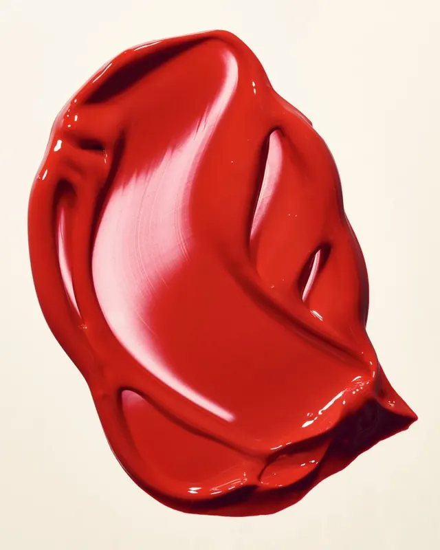 Glossy red lipstick smear macro, minimal, photographic, vibrant