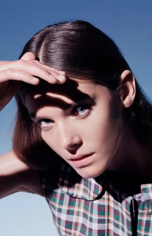 Fashion portrait with hand shadow, editorial, photographic, vibrant
