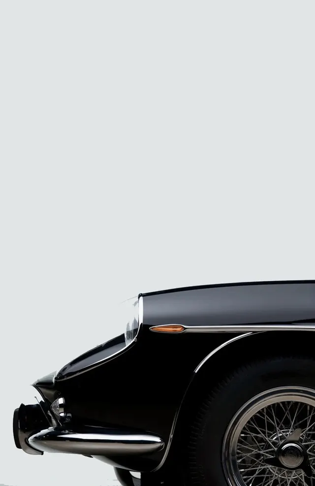 Classic car front quarter negative space, photographic, minimal, monochrome