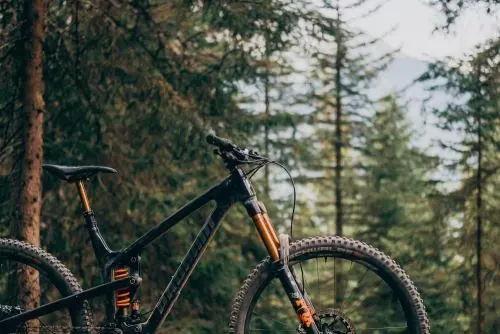 Mountain bike in forest bokeh, photographic, technical, dark