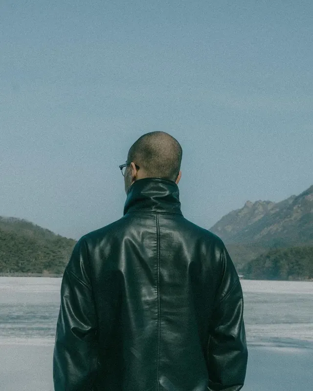 Leather jacket on frozen lake, photographic, minimal, cool