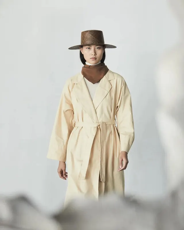 Minimal fashion portrait with wide hat, minimal, photographic, muted