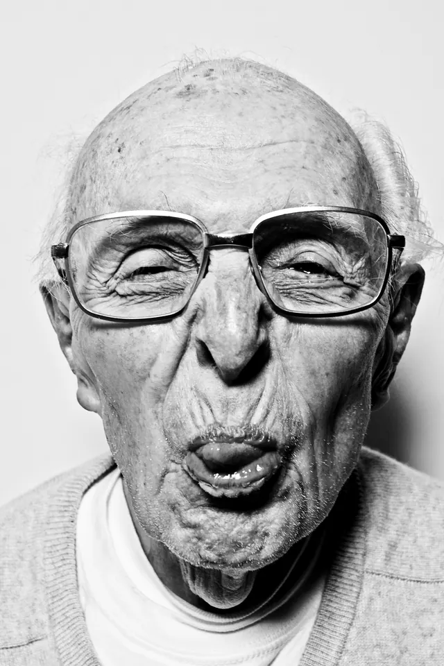 Playful elderly portrait sticking tongue out, photographic, monochrome, monochrome