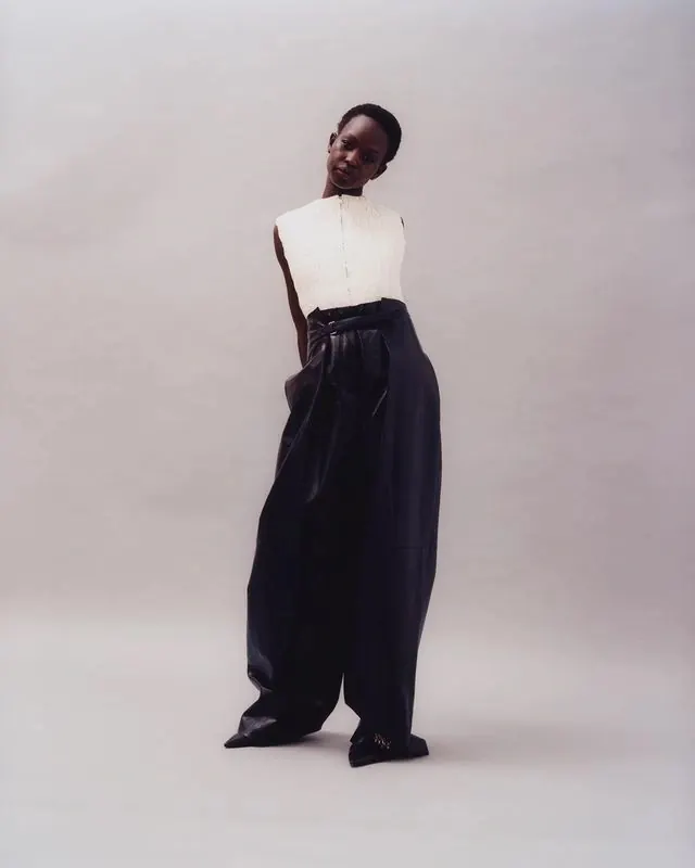 Sculptural wide-leg leather fashion portrait, minimal, photographic, monochrome