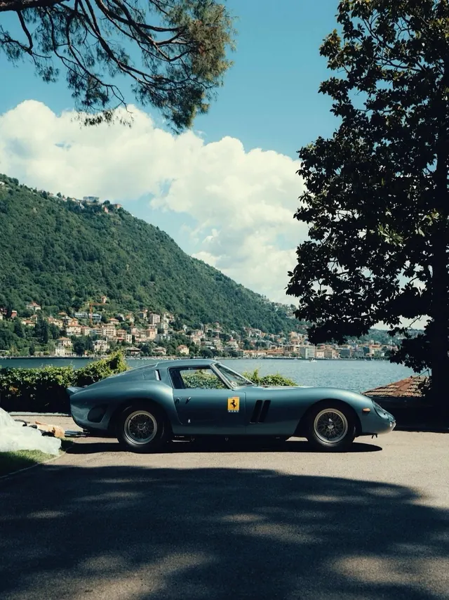 Classic blue Ferrari at lakeside vista, photographic, luxury, cool