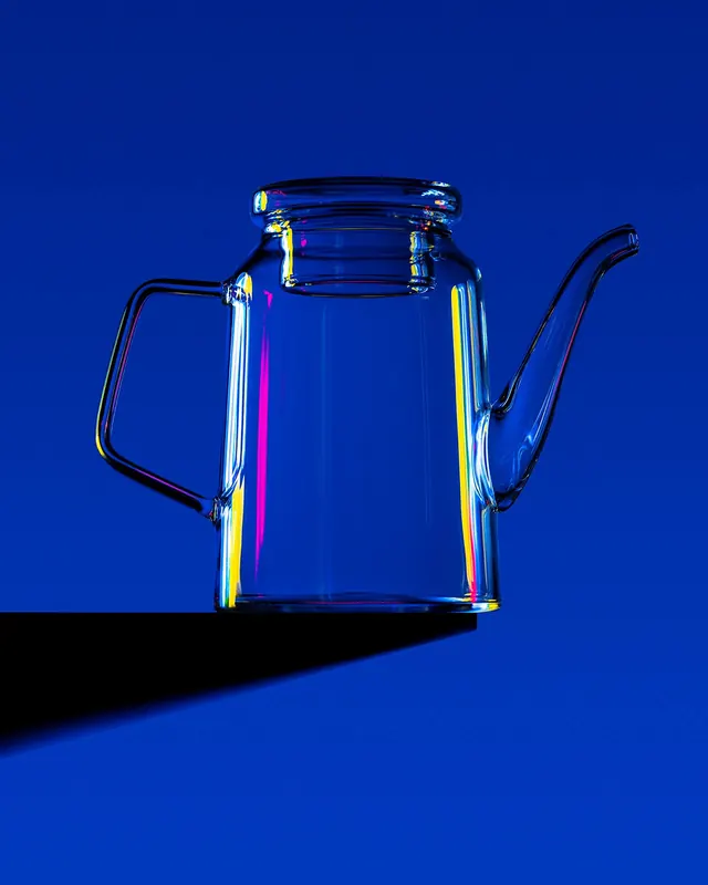 Neon-lit glass teapot on blue, minimal, photographic, vibrant